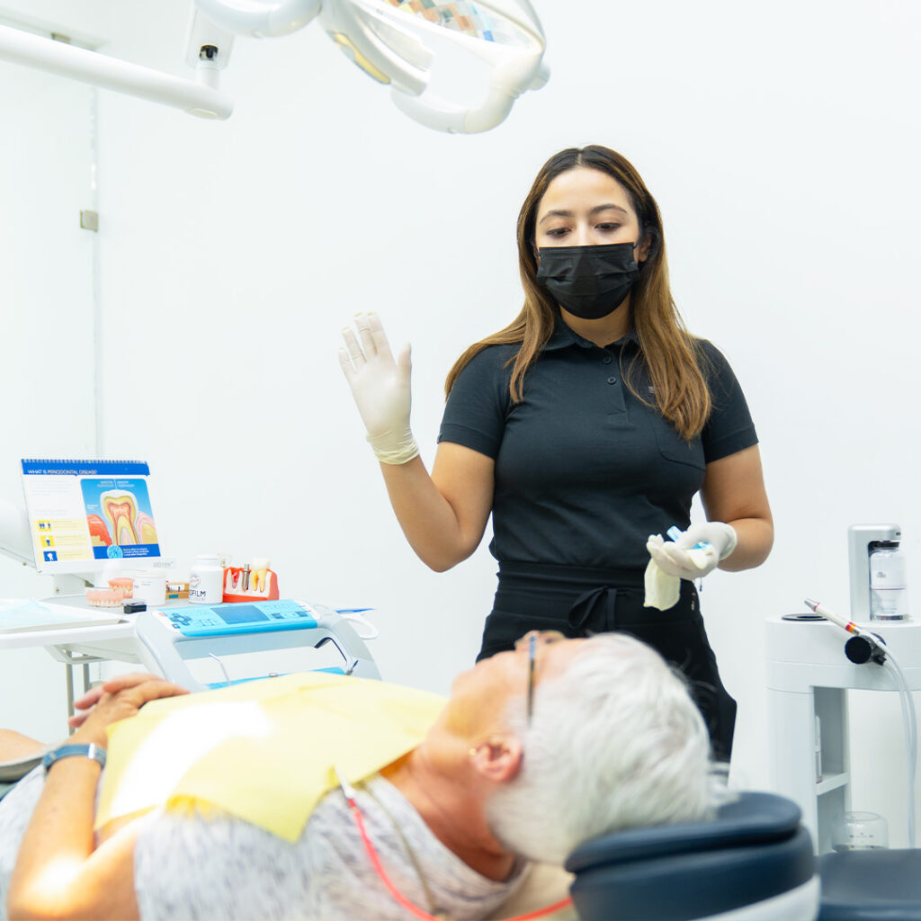 dentist explaning grown woman